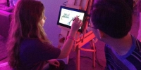 Around the room artists painted on the Windows 8 laptops and tablets.